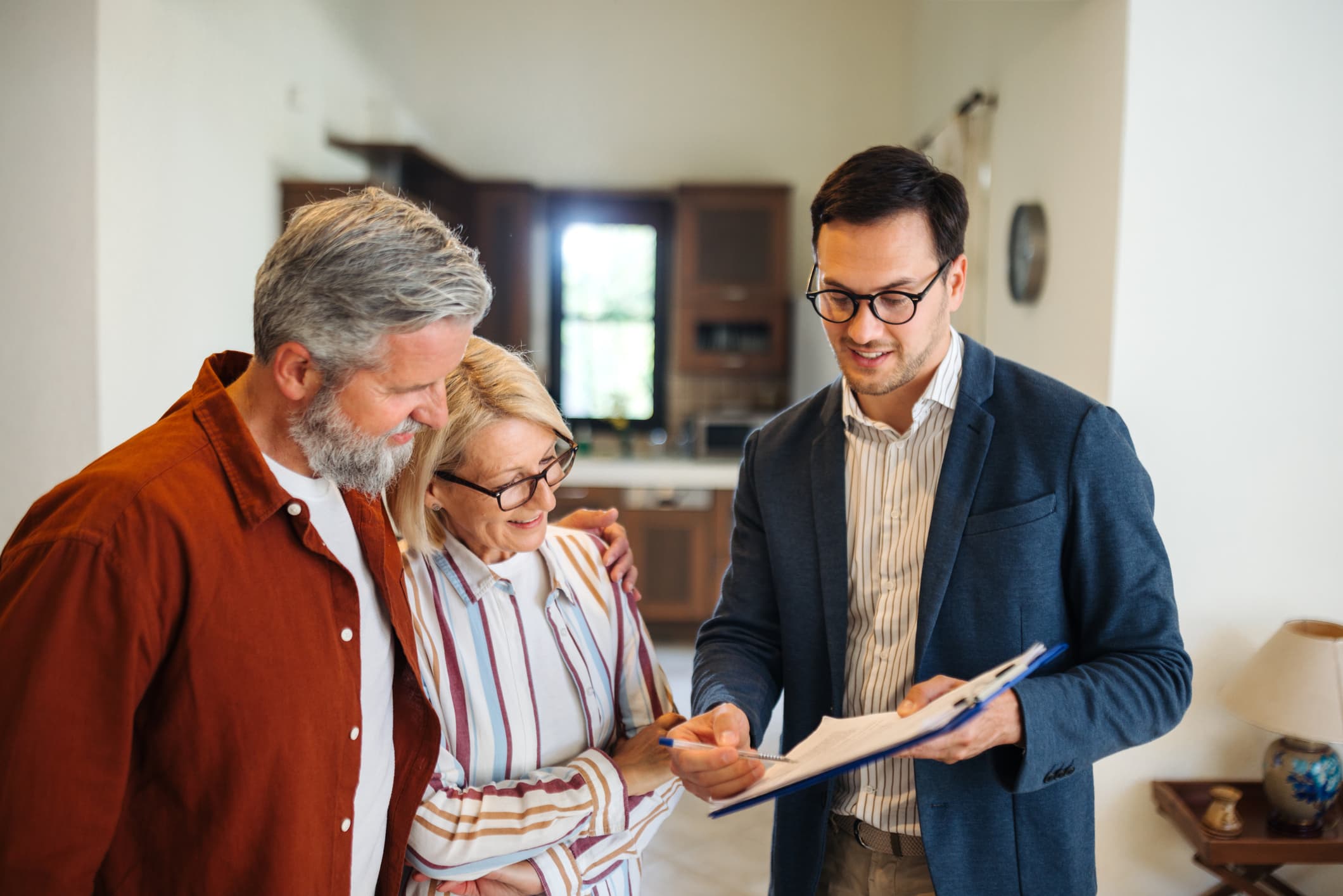 Opendoor photography — agent reviewing offer with couple