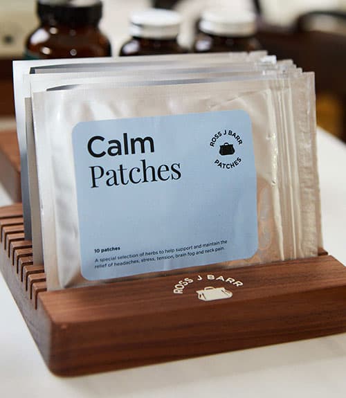Ross J Barr Calm Patches in a wood holder, retail surface in production
